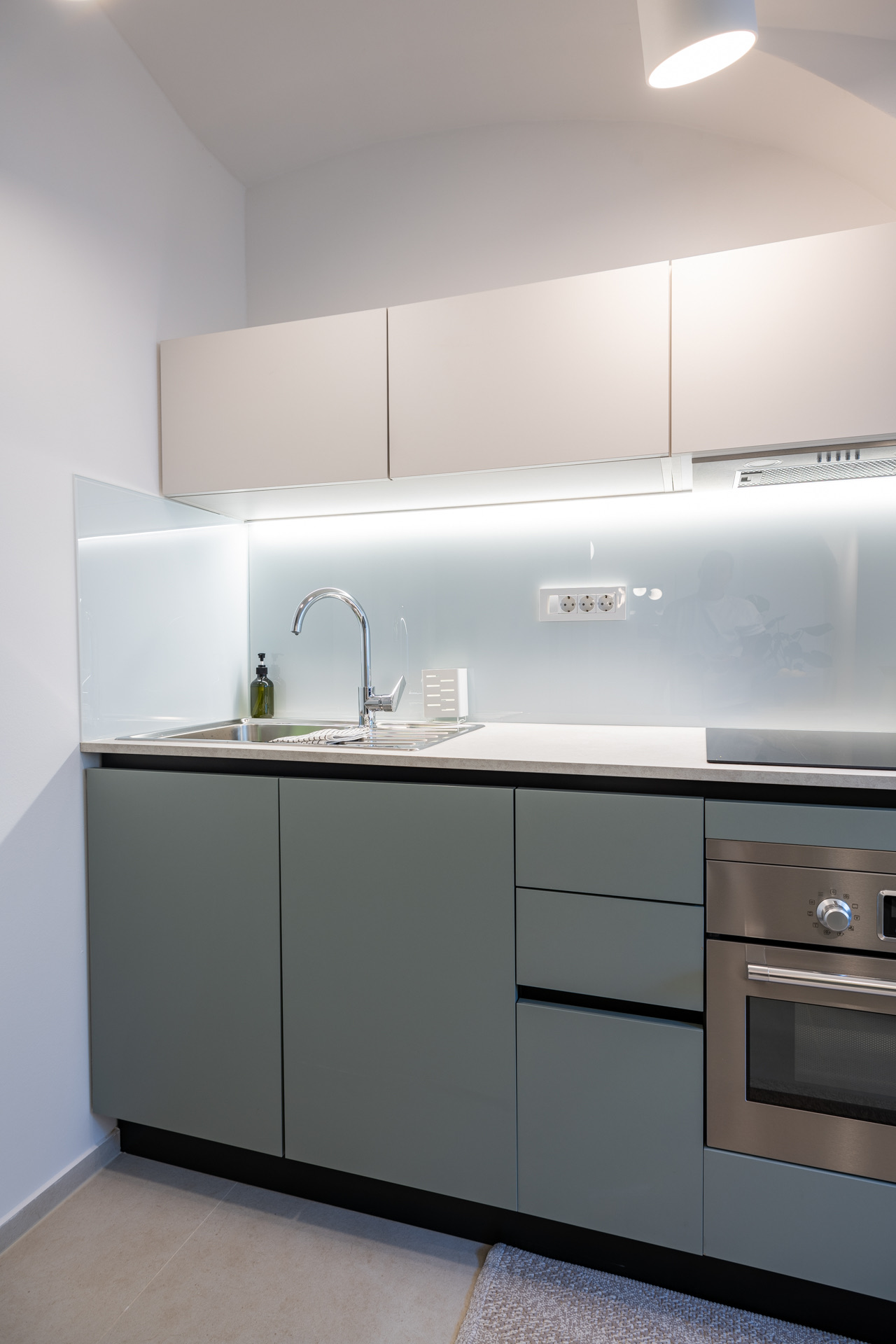 Kitchen with induction cooktop and Nespresso machine in Ljubljana apartment