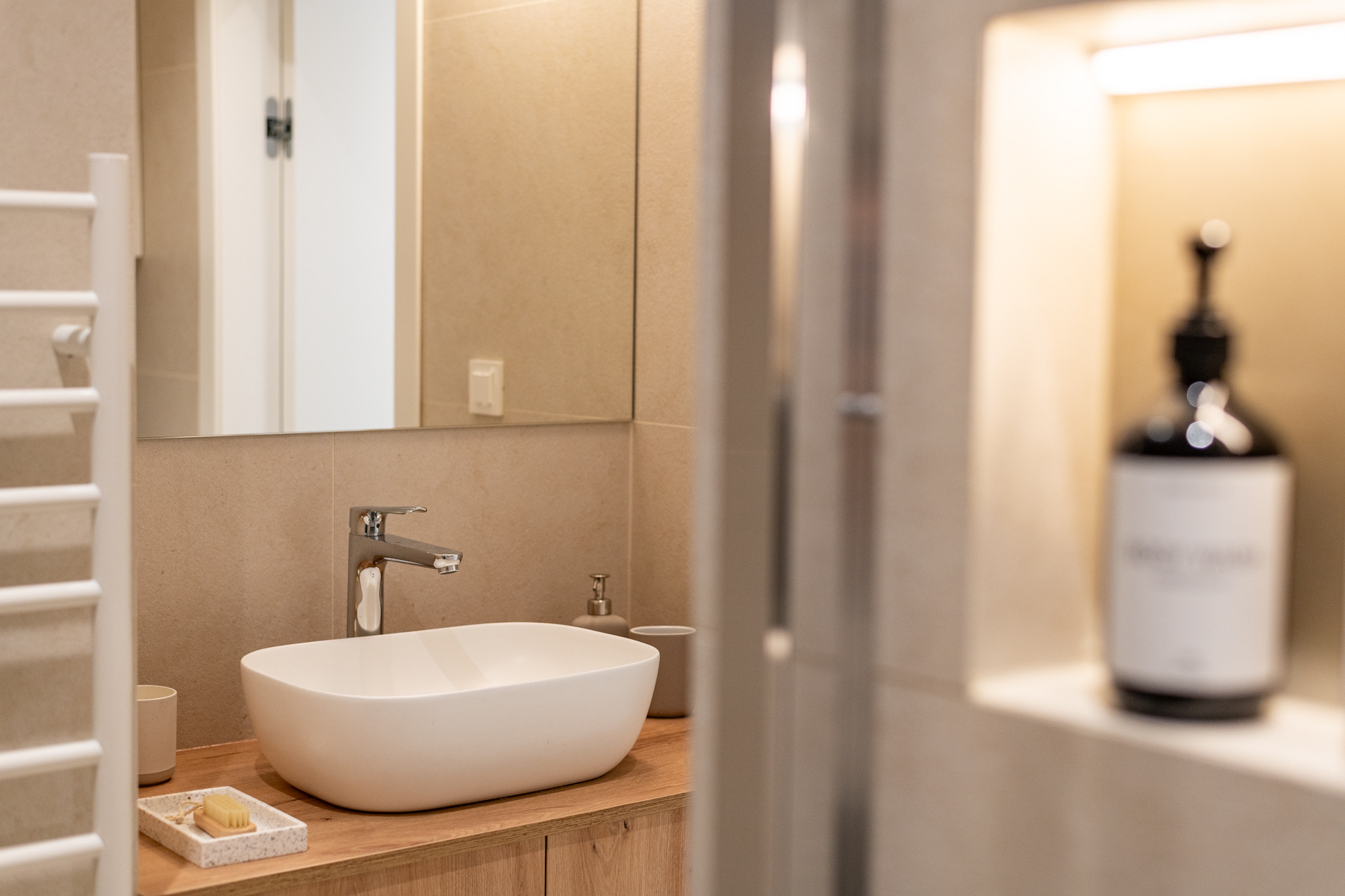 Bathroom detail with walk-in shower in The Terrace apartment